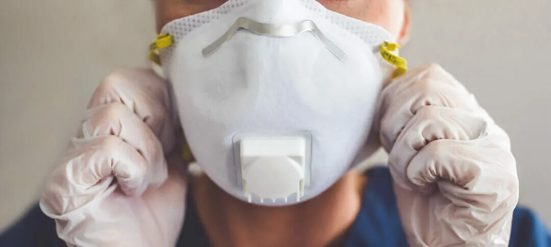 home-restoration-specialist-with-a-face-mask-on