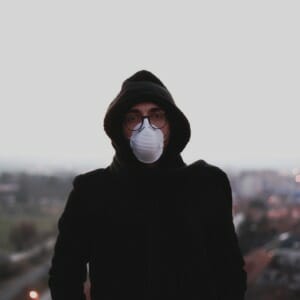 Woman wearing mask to combat the pollution in the air. 